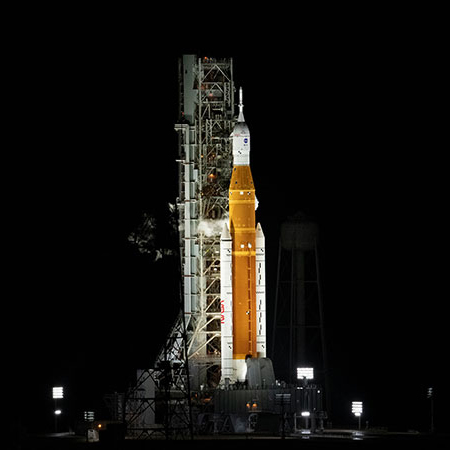 Space launch vehicle on launch pad before liftoff.