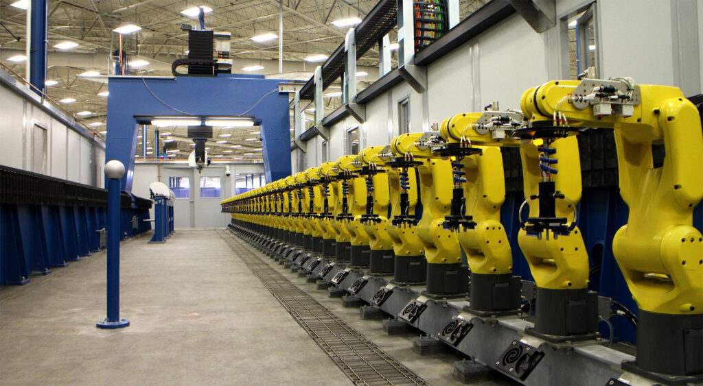 Row of PAR's flexible fixtures in a manufacturing warehouse.